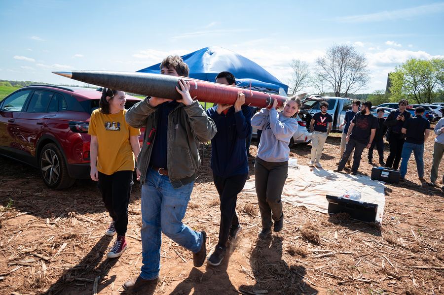 Anderson Garner and teammates carrying the Sabre III rocket to launch control